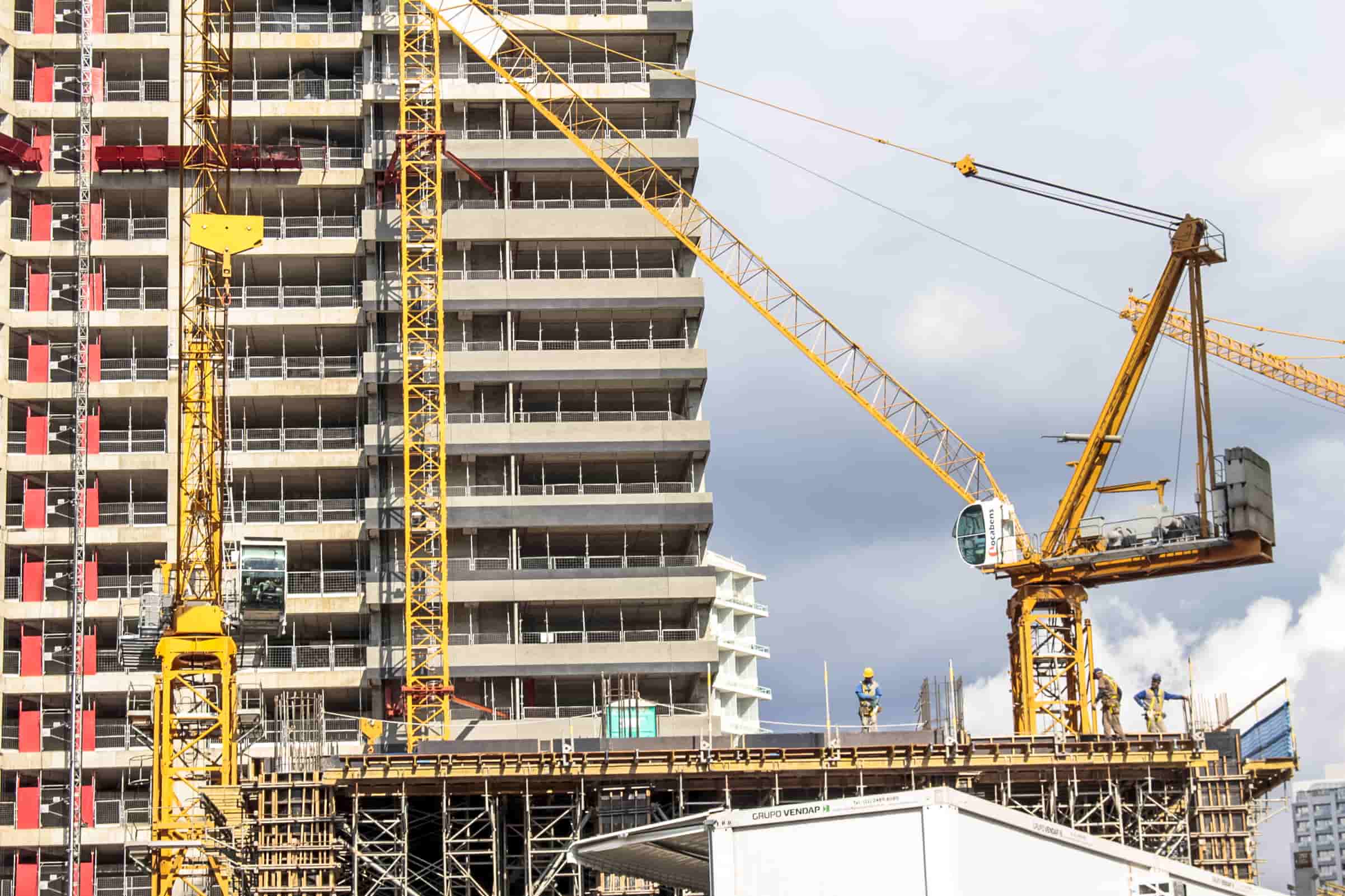 Example of large building. Building. Cranes.