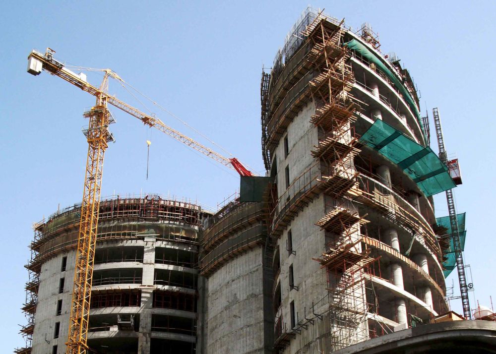 Example of large building. Building. Cranes.